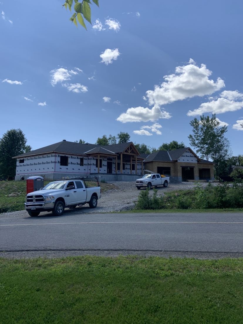 Sherrer Construction trucks outside two new houses